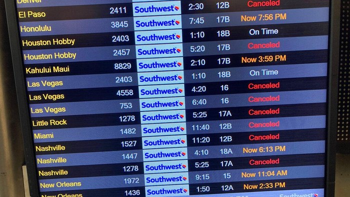 Baggage waits to be claimed after canceled flights at the Southwest Airlines terminal at Los Angeles International Airport on Monday, Dec. 26, 2022, in Los Angeles. (AP Photo/Eugene Garcia)