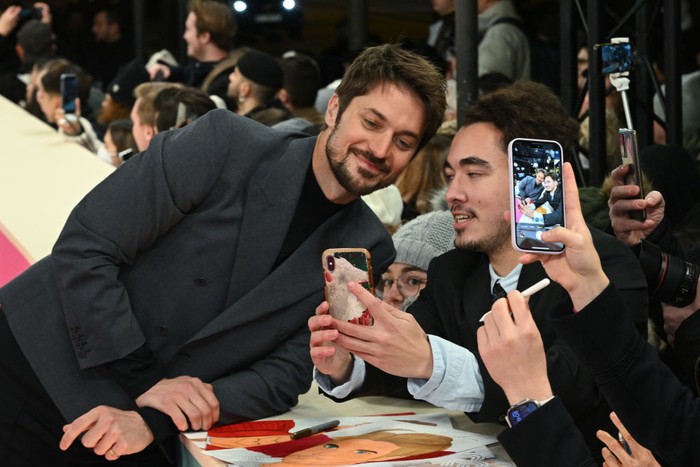 PARIS, FRANCE - DECEMBER 06: Lucas Bravo  attends the Emily In Paris by Netflix - Season 3 World Premiere at Theatre Des Champs Elysees on December 06, 2022 in Paris, France. (Photo by Stephane Cardinale - Corbis/Corbis via Getty Images)
