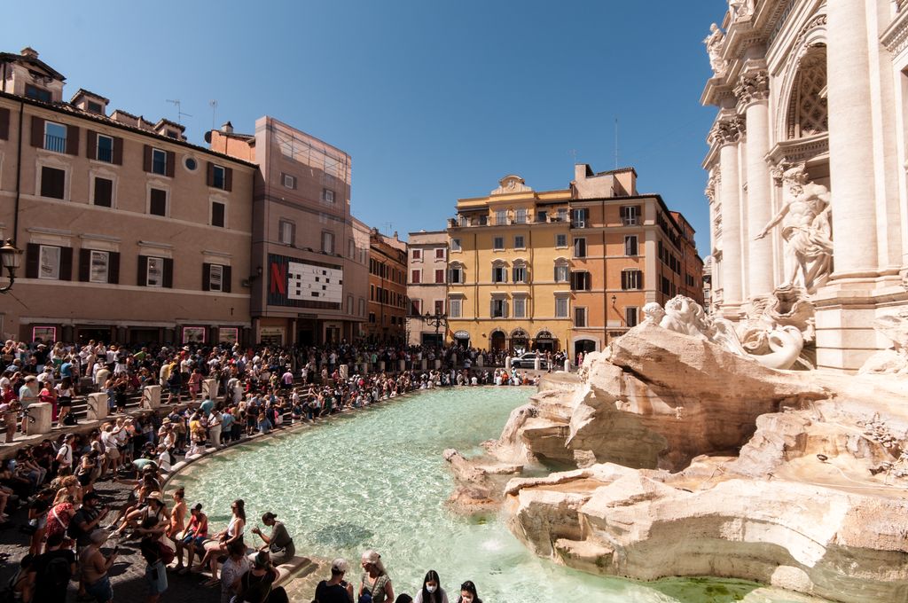 The Trevi Fountain with tourists in Rome, Italy, 23 August 2022. (Photo by Andrea Ronchini/NurPhoto via Getty Images)