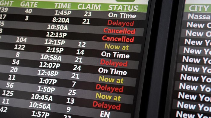 ORLANDO, FLORIDA, UNITED STATES - DECEMBER 28: A flight status board displays delayed and cancelled flights  during the busy Christmas holiday season at Orlando International Airport on December 28, 2022 in Orlando, Florida. The holiday travel period has been plagued by a winter storm and thousands of delayed and cancelled flights, the majority of which have occurred at Southwest Airlines. (Photo by Paul Hennessy/Anadolu Agency via Getty Images)