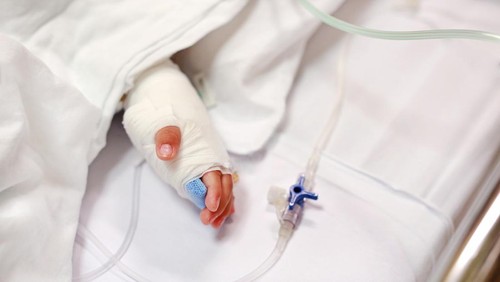 Little boy get sick from influenza need to be admitted to hospital with saline intravenous (iv)  in-line hand pressure