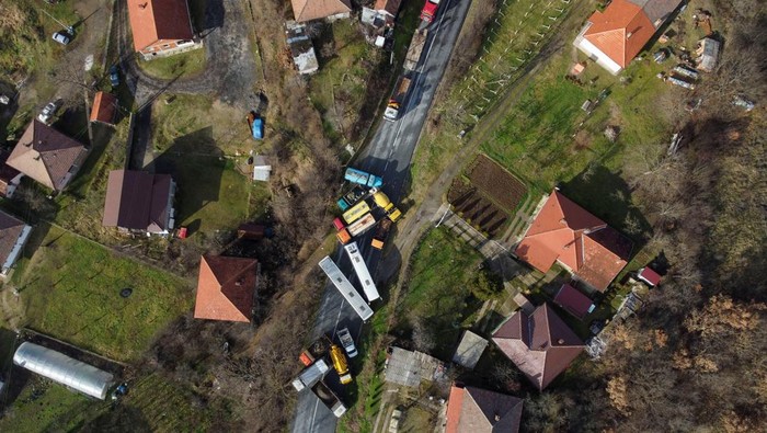 Burned trucks block a road in the ethnically divided town of Mitrovica, Kosovo December 29, 2022. REUTERS/Florion Goga