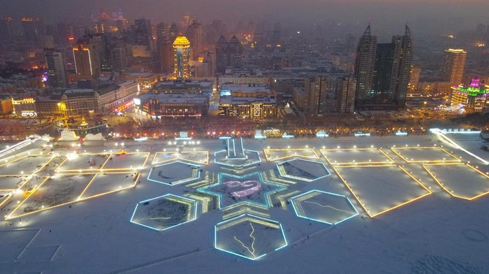 HARBIN, CHINA - DECEMBER 29: LED light strips forming in the shape of snowflake are illuminated during the 5th Songhua River Ice and Snow Carnival on December 29, 2022 in Harbin, Heilongjiang Province of China. (Photo by VCG/VCG via Getty Images)