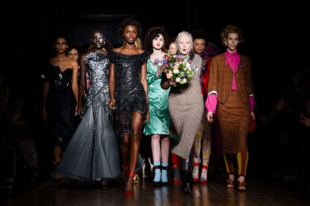 British designer Vivienne Westwood (3rd R) stands with models during the finale of her catwalk show at the Autumn / Winter 2016 London Fashion Week in London on February 21, 2016. / AFP / LEON NEAL        (Photo credit should read LEON NEAL/AFP via Getty Images)