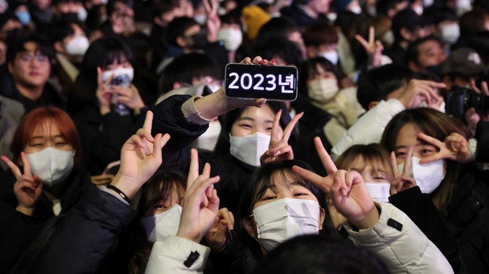 People celebrate New Year's eve in Seoul, South Korea, December 31, 2022. REUTERS/Kim Hong-Ji