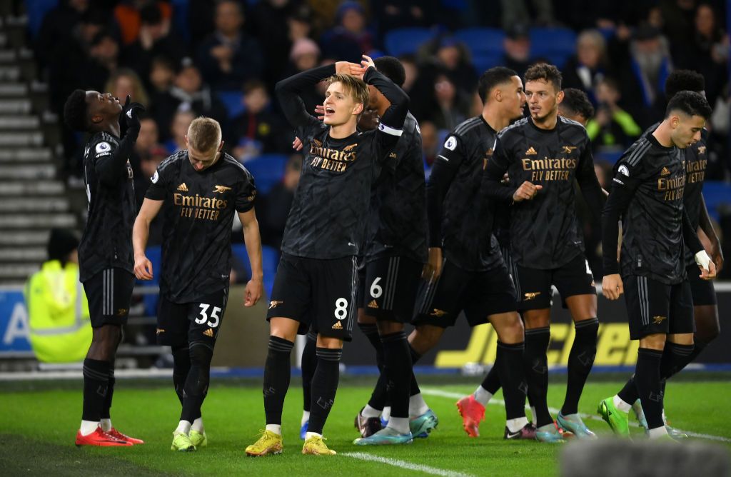 Brighton vs Arsenal BRIGHTON, ENGLAND - DECEMBER 31: Martin Odegaard of Arsenal celebrates with teammates after teammate (L) Eddie Nketiah scores the team's third goal during the Premier League match between Brighton & Hove Albion and Arsenal FC at American Express Community Stadium on December 31, 2022 in Brighton, England. (Photo by Mike Hewitt/Getty Images)