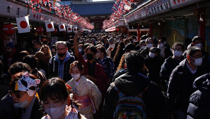 People leave after offering prayers on the first day of the new year at Senso-ji temple in Tokyo, Japan, January 1, 2023. REUTERS/Androniki Christodoulou