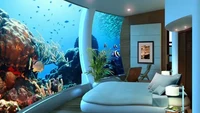 Selain restoran, Poseidon resort di pulau Fiji menawarkan kehidupan di bawah laut. Mulai dari kamar hingga ruang makan memiliki pemandangan 360 derajat di bawah laut. Foto: Insider