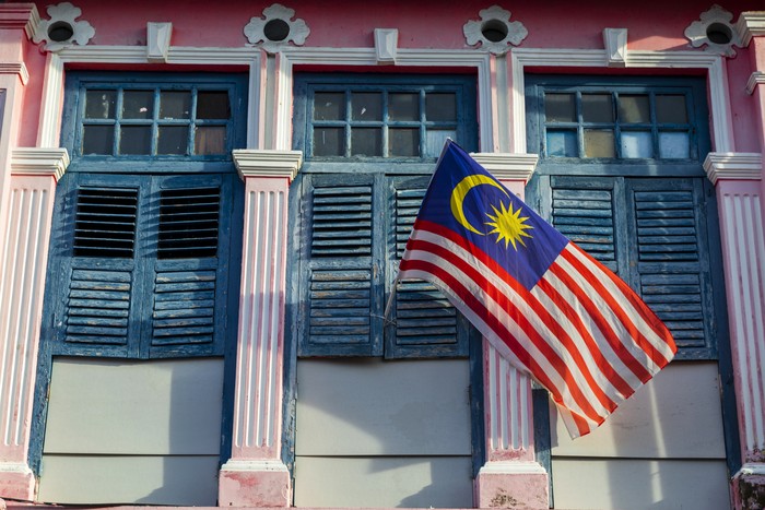 The flag of Malaysia is composed of a field of 14 alternating red and white stripes along the fly and a blue canton bearing a crescent and a 14-point star known as the Bintang Persekutuan (Federal Star). The 14 stripes, of equal width, represent the equal status in the federation of the 13 member states and the federal territories, while the 14 points of the star represent the unity between these entities. The crescent represents Islam, the countrys state religion; the blue canton symbolises the unity of the Malaysian people; the yellow of the star and crescent is the royal colour of the Malay rulers.