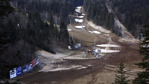 General view over the ski track with only a few patches of snow on Bjelasnica mountain near Sarajevo, Bosnia, Wednesday, Jan. 4, 2023. (AP Photo/Armin Durgut)