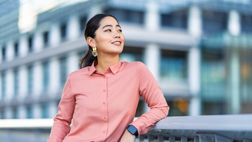 A portrait of a beautiful businesswoman in the city.