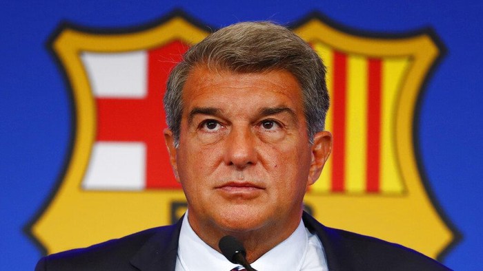 FILE - FC Barcelona club President Joan Laporta pauses during a news conference in Barcelona, Spain, on Aug. 6, 2021. Barcelona won’t be able to reduce its salary burden to acceptable limits for the club until several veteran players finish their contracts, its top financial officer said Thursday, Oct. 6, 2022. (AP Photo/Joan Monfort, File)