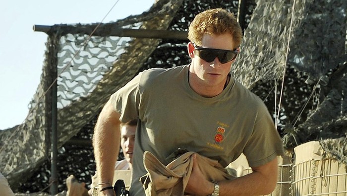 FILE - Britains Prince Harry races out from the VHR (very high ready-ness) tent to scramble his Apache with fellow Pilots, during his 12 hour shift at the British controlled flight-line in Camp Bastion southern Afghanistan, Nov. 3, 2012. Prince Harry alleges in a much-anticipated new memoir that his brother Prince William lashed out and physically attacked him during a furious argument over the brothers’ deteriorating relationship. The book “Spare