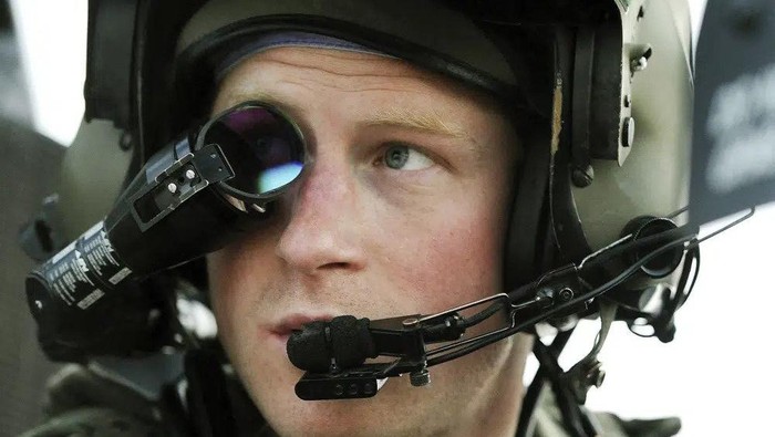FILE - In this Dec. 12, 2012 file photo Britains Prince Harry or just plain Captain Wales as he is known in the British Army, wears his monocle gun sight as he sits in the front seat of his cockpit at the British controlled flight-line in Camp Bastion southern Afghanistan. (AP Photo/ John Stillwell, File)