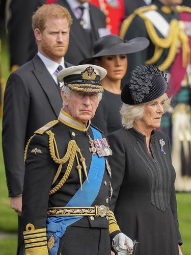 Britain's King Charles III, from bottom left, Camilla, the Queen Consort, Prince Harry and Meghan, Duchess of Sussex watch as the coffin of Queen Elizabeth II is placed into the hearse following the state funeral service in Westminster Abbey in central London Monday Sept. 19, 2022. The Queen, who died aged 96 on Sept. 8, will be buried at Windsor alongside her late husband, Prince Philip, who died last year. (AP Photo/Martin Meissner, Pool)