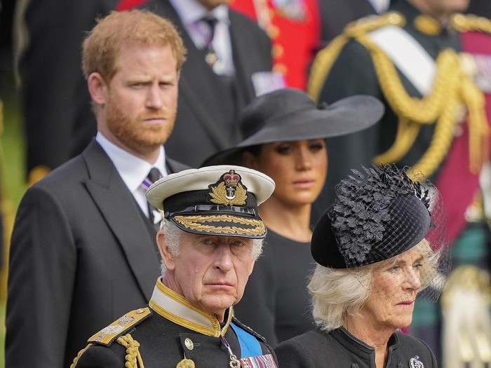 Britains King Charles III, from bottom left, Camilla, the Queen Consort, Prince Harry and Meghan, Duchess of Sussex watch as the coffin of Queen Elizabeth II is placed into the hearse following the state funeral service in Westminster Abbey in central London Monday Sept. 19, 2022. The Queen, who died aged 96 on Sept. 8, will be buried at Windsor alongside her late husband, Prince Philip, who died last year. (AP Photo/Martin Meissner, Pool)