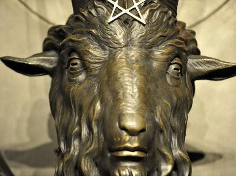 The Baphomet statue is seen in the conversion room at the Satanic Temple where a 