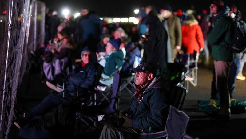 People watch Britain's first satellite launch on a screen, at Cornwall Airport Newquay, in Cornwall, Britain January 9, 2023. REUTERS/Henry Nicholls