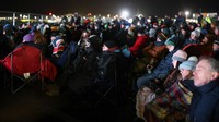 People watch Britains first satellite launch on a screen, at Cornwall Airport Newquay, in Cornwall, Britain January 9, 2023. REUTERS/Henry Nicholls