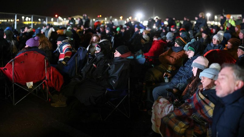 People watch Britain's first satellite launch on a screen, at Cornwall Airport Newquay, in Cornwall, Britain January 9, 2023. REUTERS/Henry Nicholls