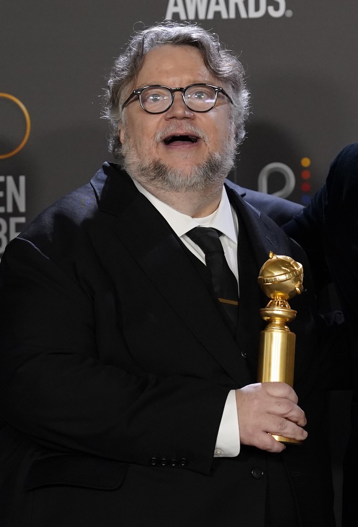 Guillermo del Toro poses in the press room with the award for best motion picture, animated for 