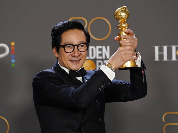 Ke Huy Quan poses in the press room with the award for best performance by an actor in a supporting role in any motion picture for Everything Everywhere All at Once at the 80th annual Golden Globe Awards at the Beverly Hilton Hotel on Tuesday, Jan. 10, 2023, in Beverly Hills, Calif. (Photo by Chris Pizzello/Invision/AP)