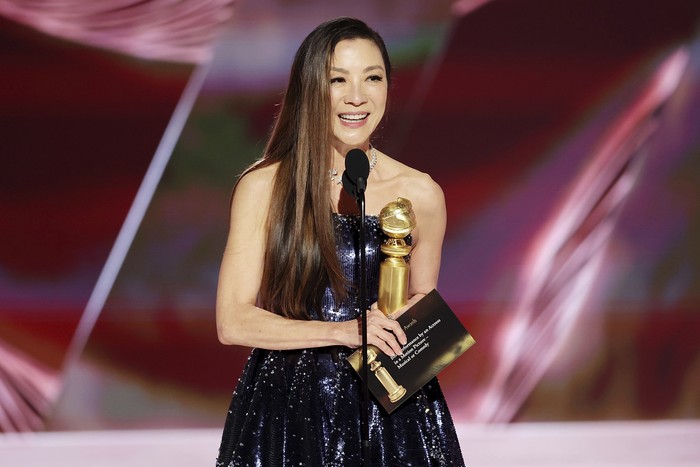This image released by NBC shows Michelle Yeoh accepting the Best Actress in a Motion Picture – Musical or Comedy award for 