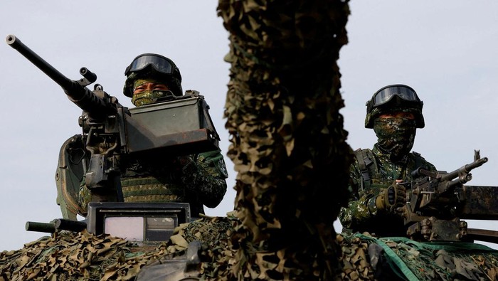 Members of Taiwans armed forces participate in the two-day routine drill to show combat readiness ahead of Lunar New Year holidays, at a military base in Kaohsiung, Taiwan, January 12, 2023. REUTERS/Ann Wang