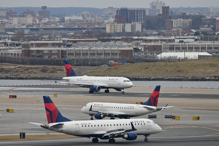 Delta Airlines planes taxi at LaGuardia airport in New York on January 11, 2023 - The US Federal Aviation Authority  said Wednesday that normal flight operations 