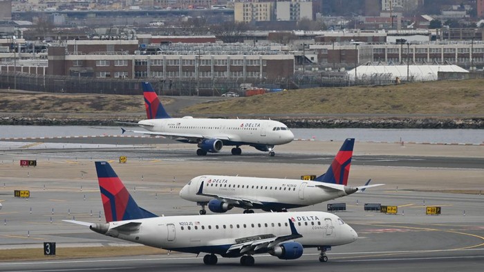 Delta Airlines planes taxi at LaGuardia airport in New York on January 11, 2023 - The US Federal Aviation Authority  said Wednesday that normal flight operations 