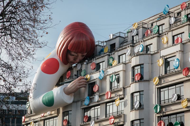 An advertisement for Louis Vuitton covers the exterior of the luxury brand's flagship store, on the first day of the winter sales, on the Champs-Elysee avenue in Paris, France, on Wednesday, Jan. 11, 2023. The rising cost of living is already dragging on economic output in France as consumer spending power declines. Photographer: Cyril Marcilhacy/Bloomberg via Getty Images
