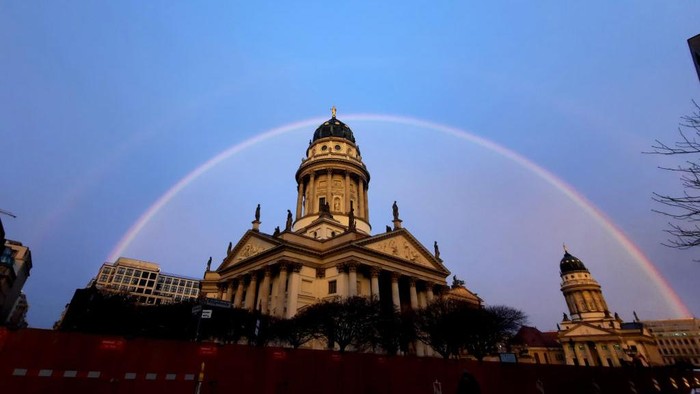 04 January 2023, Berlin: A rainbow over the Gendarmenmarkt and the German Cathedral (l) and the French Cathedral in Berlin Mitte. Photo: XAMAX/dpa (Photo by XAMAX/picture alliance via Getty Images)