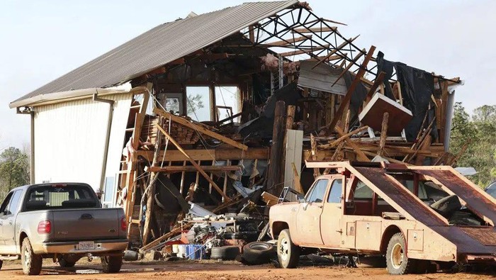 A damaged home is seen in the aftermath of severe weather, Thursday, Jan. 12, 2023, near Prattville, Ala. A large tornado damaged homes and uprooted trees in Alabama on Thursday as a powerful storm system pushed through the South. (AP Photo/Vasha Hunt)
