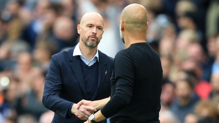 Manchester Citys Spanish manager Pep Guardiola (R) and Manchester Uniteds Dutch manager Erik ten Hag (2R) shake hands after the English Premier League football match between Manchester City and Manchester United at the Etihad Stadium in Manchester, north west England, on October 2, 2022. - RESTRICTED TO EDITORIAL USE. No use with unauthorized audio, video, data, fixture lists, club/league logos or live services. Online in-match use limited to 120 images. An additional 40 images may be used in extra time. No video emulation. Social media in-match use limited to 120 images. An additional 40 images may be used in extra time. No use in betting publications, games or single club/league/player publications. (Photo by Lindsey Parnaby / AFP) / RESTRICTED TO EDITORIAL USE. No use with unauthorized audio, video, data, fixture lists, club/league logos or live services. Online in-match use limited to 120 images. An additional 40 images may be used in extra time. No video emulation. Social media in-match use limited to 120 images. An additional 40 images may be used in extra time. No use in betting publications, games or single club/league/player publications. / RESTRICTED TO EDITORIAL USE. No use with unauthorized audio, video, data, fixture lists, club/league logos or live services. Online in-match use limited to 120 images. An additional 40 images may be used in extra time. No video emulation. Social media in-match use limited to 120 images. An additional 40 images may be used in extra time. No use in betting publications, games or single club/league/player publications. (Photo by LINDSEY PARNABY/AFP via Getty Images)