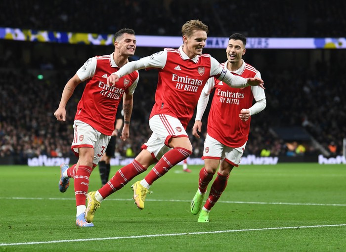 LONDON, ENGLAND - JANUARY 15: Martin Odegaard celebrates scoring Arsenals 2nd goal with Granit Xhaka and Gabriel Martinelli during the Premier League match between Tottenham Hotspur and Arsenal FC at Tottenham Hotspur Stadium on January 15, 2023 in London, England. (Photo by David Price/Arsenal FC via Getty Images)