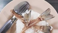 Bukan pakai daging ikannya, orang ini justru makan nasi pakai lauk tulang dan duri ikan yang tersisa.  Foto: Instagram /Twitter