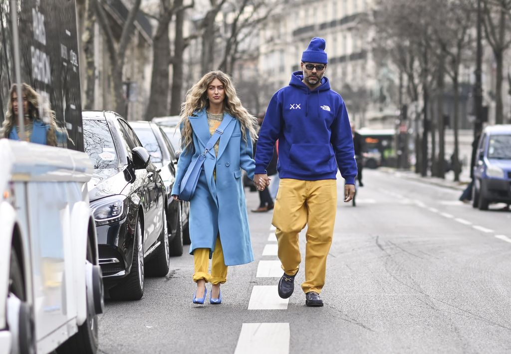 PARIS, FRANCE - MARCH 02: Emili Sindlev and Mads Emil are seen wearing blue and yellow outfits outside the Cecilie Bahnsen show during Paris Fashion Week A/W 2022 on March 02, 2022 in Paris, France. (Photo by Daniel Zuchnik/Getty Images)
