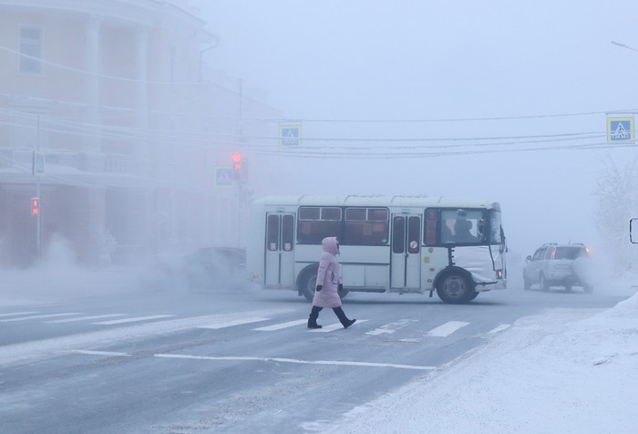 A car drives along a road on a frosty day in Yakutsk, Russia, January 15, 2023. Yakutsk, one of the Russias north-most cities, is hit by an extreme cold snap as the air temperature on Sunday (January 15) plunged as low as minus 51 degrees Celsius (minus 59.8 degrees Fahrenheit). REUTERS/Roman Kutukov