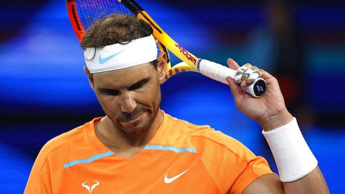 Ekspresi Rafael Nadal Kala Tersingkir dari Australia Open 2023 Rafael Nadal of Spain reacts during his second round match against Mackenzie McDonald of the U.S., at the Australian Open tennis championship in Melbourne, Australia, Wednesday, Jan. 18, 2023. (AP Photo/Asanka Brendon Ratnayake)