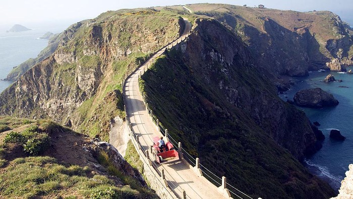 La Coupee narrow track between Sark and Little Sark, Island of Sark, Channel Islands, Great Britain. (Photo By: Geography Photos/Universal Images Group via Getty Images)