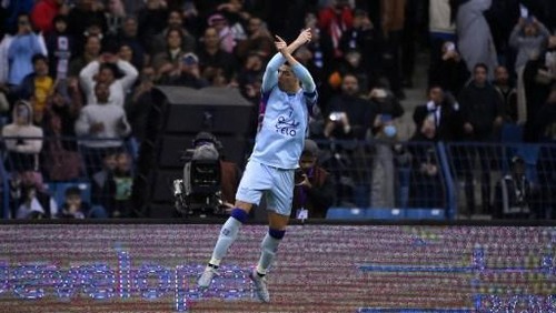 Riyadh All-Stars Portuguese forward Cristiano Ronaldo celebrates after scoring his teams first goal form the penalty spot during the Riyadh Season Cup football match between the Riyadh All-Stars and Paris Saint-Germain at the King Fahd Stadium in Riyadh on January 19, 2023. (Photo by FRANCK FIFE / AFP)