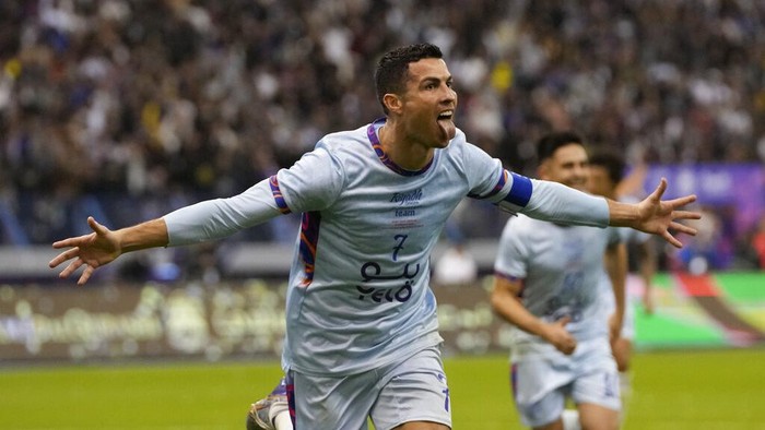 Cristiano Ronaldo celebrates after scoring his sides second goal playing for a combined XI of Saudi Arabian teams Al Nassr and PSG during a friendly soccer match, at the King Saud University Stadium, in Riyadh, Saudi Arabia, Thursday, Jan. 19, 2023. (AP Photo/Hussein Malla)