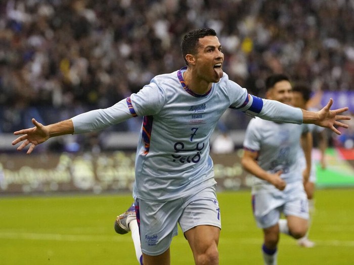 Cristiano Ronaldo celebrates after scoring his side's second goal playing for a combined XI of Saudi Arabian teams Al Nassr and PSG during a friendly soccer match, at the King Saud University Stadium, in Riyadh, Saudi Arabia, Thursday, Jan. 19, 2023. (AP Photo/Hussein Malla)