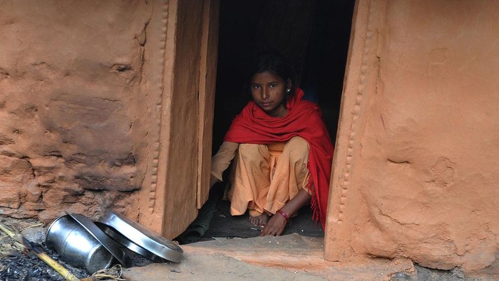 TO GO WITH Nepal-women-religion-society-chhaupadi,FEATURE by Frankie Taggart
Thirteen year old Nepalese villager Sarswati Biswo-Karma sits inside a 