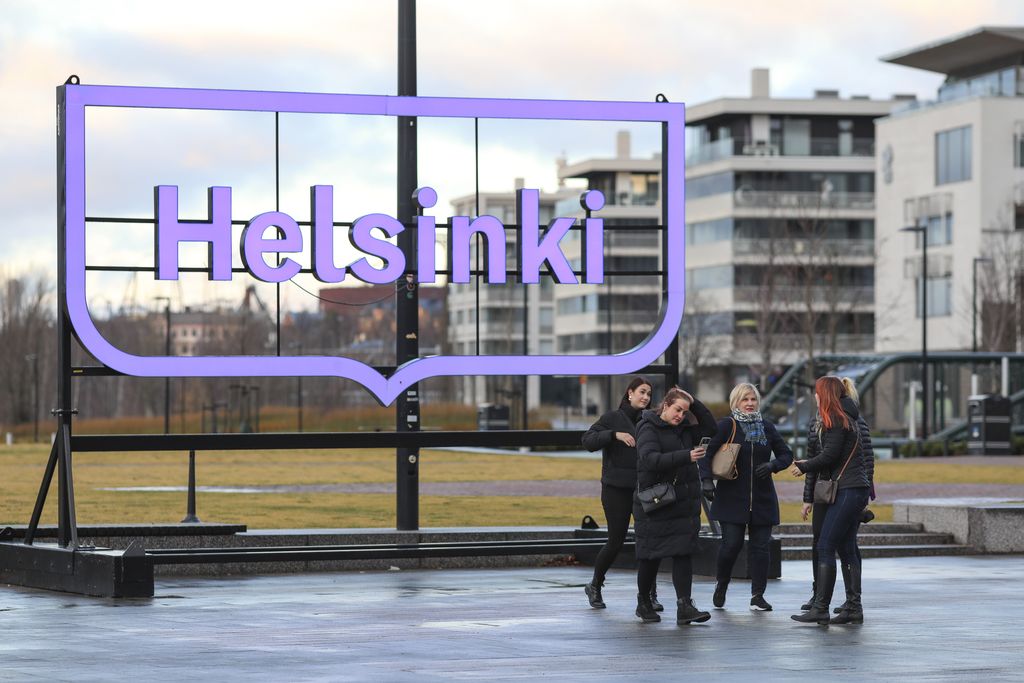 HELSINKI, UUSIMAA, FINLAND - 2021/11/18: Group of women take pictures in Kansalaistori square. (Photo by Takimoto Marina/SOPA Images/LightRocket via Getty Images)