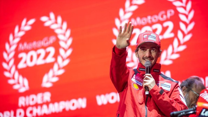 BOLOGNA, ITALY - DECEMBER 15: MotoGp World Champion Francesco Bagnaia of the Ducati team speaks on stage during a celebration for Ducatis MotoGP and WorldSBK world titles on December 15, 2022 in Bologna, Italy. (Photo by Michele Lapini/Getty Images)