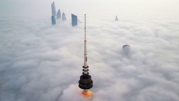 This aerial view shows Kuwait City in a heavy fog, on January 22, 2023. (Photo by YASSER AL-ZAYYAT / AFP) (Photo by YASSER AL-ZAYYAT/AFP via Getty Images)