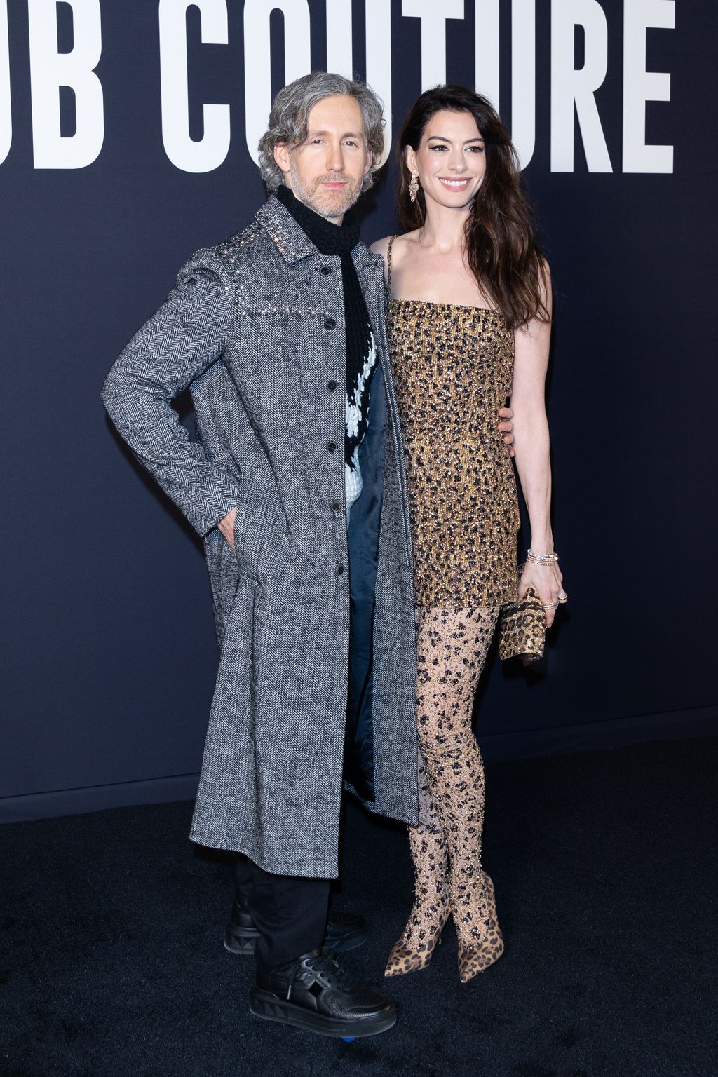 PARIS, FRANCE - JANUARY 25: (EDITORIAL USE ONLY - For Non-Editorial use please seek approval from Fashion House) (L-R) Adam Shulman and Anne Hathaway attend the Valentino Haute Couture Spring Summer 2023 show as part of Paris Fashion Week on January 25, 2023 in Paris, France. (Photo by Marc Piasecki/WireImage)
