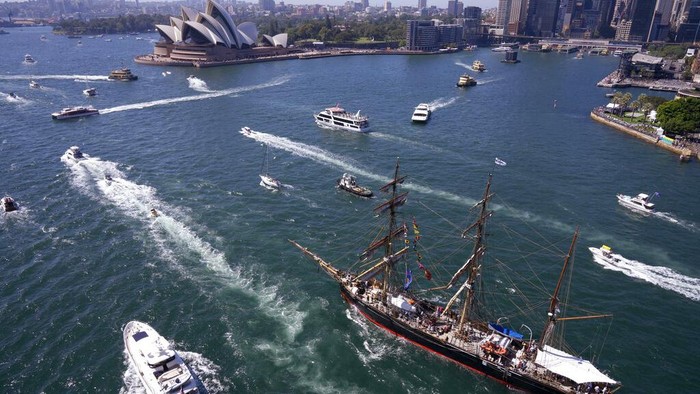 Pleasure craft and a tall ship sail on Sydney Harbour during Australia Day celebration in Sydney, Thursday, Jan. 26, 2023. Australia marks the anniversary of British colonists settling modern day Sydney in 1788 while Indigenous protesters deride Australia Day as Invasion Day. (AP Photo/Rick Rycroft)