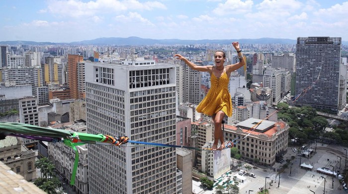 Rafael Bridi balances on a highline at 114 meters high and 510 meters long in an attempt to break a record for the longest walk in the Americas, in Sao Paulo, Brazil January 25, 2023. REUTERS/Carla Carniel